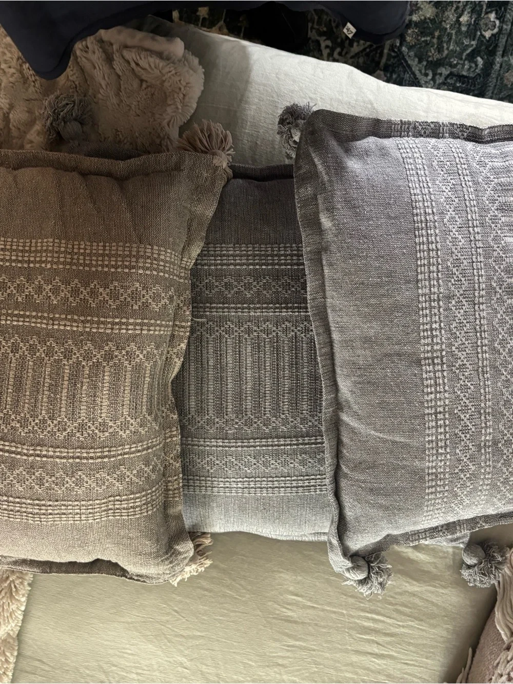 3 square gray pillows